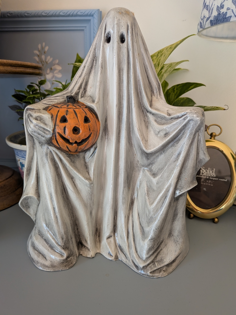 Halloween Ghost Holding Pumpkin Ceramic Figurine - White and Orange